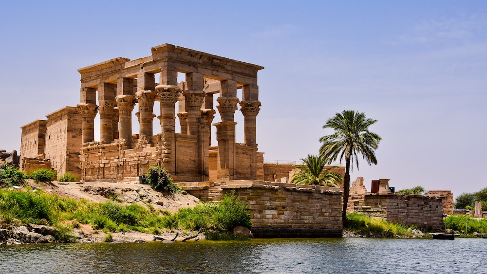 The Divine Sky: Philae's Columns Reflected in Aswan's Waters